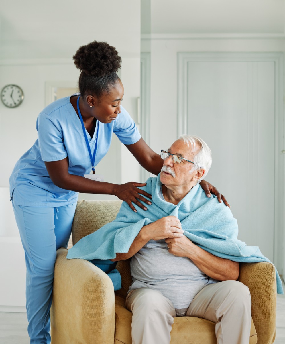 A caregiver supporting an older adult
